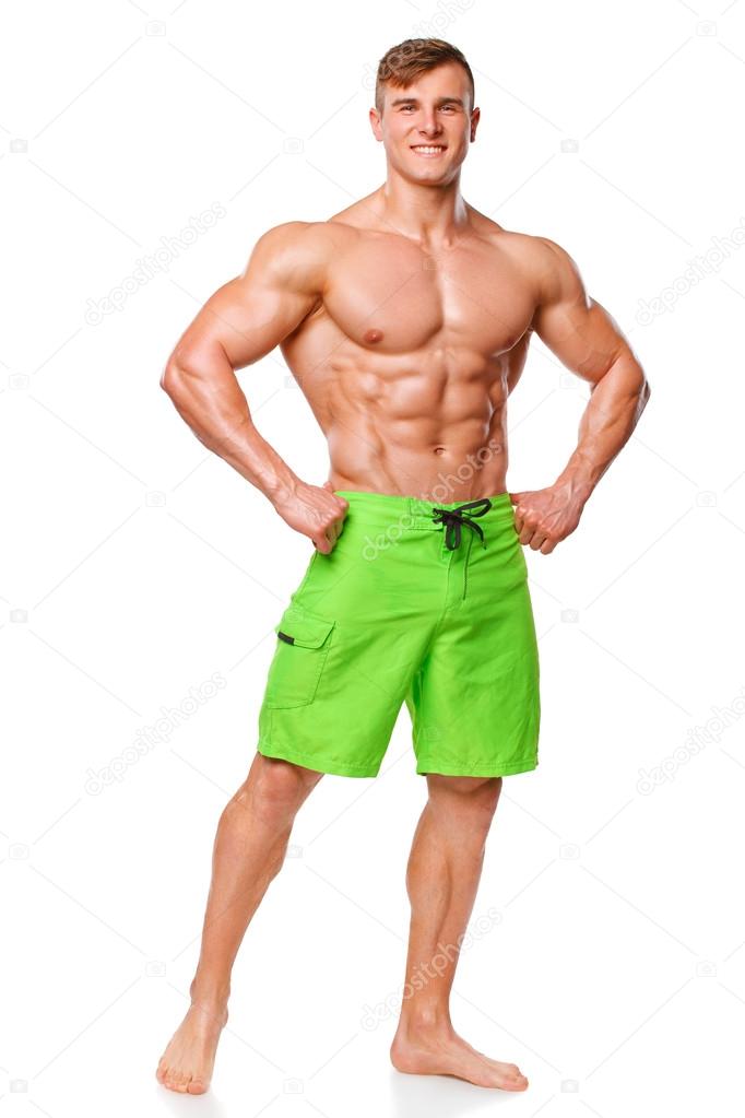 Sexy athletic man showing muscular body, isolated over white background. Strong male nacked torso abs