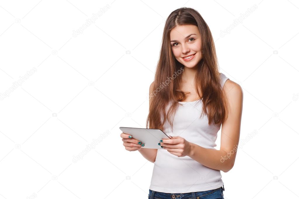 Attractive smiling girl in white shirt using tablet. Woman with tablet pc, isolated on white background