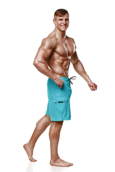 Sexy athletischer Mann mit muskulösem Körper, isoliert vor weißem Hintergrund. starke männliche Oberkörper-Bauchmuskeln — Stockfoto