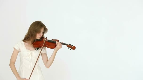 Caucasian violinist girl on a white background. — Stock Video