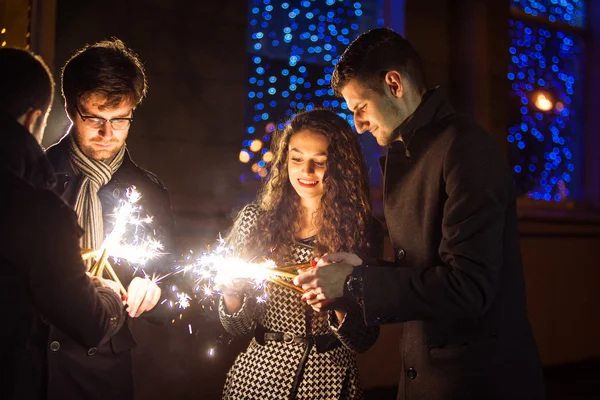 Friends with sparklers — Stock Photo, Image