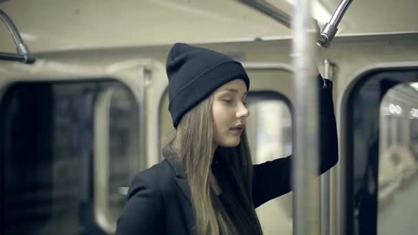 Teen girl rides the metro at night — Stock Video