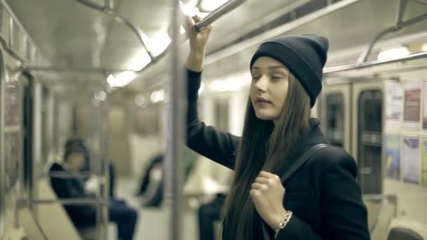 Teen girl rides the metro at night — Stock Video