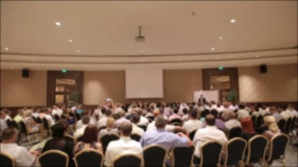 Many people came together at a conference or seminar. Blurred background for title. — Stock Video