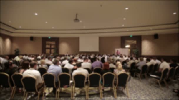 Many people came together at a conference or seminar. Blurred background for title. — Stock Video