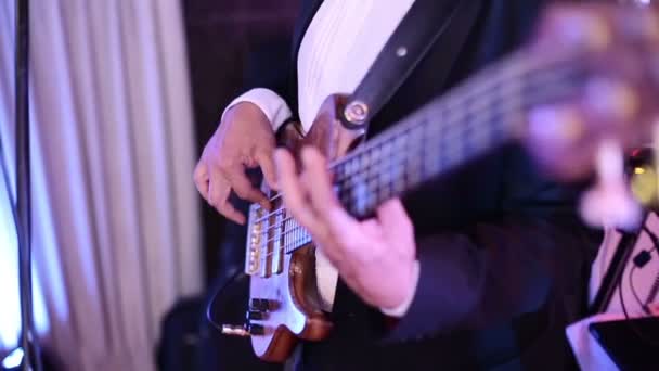 SLOW MOTION: Musician playing bass guitar — Stock Video