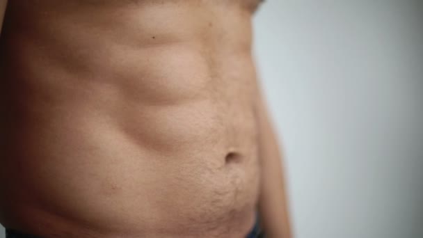 Embossed torso turns into a paunchy belly man loses weight and gets fat — Stock Video