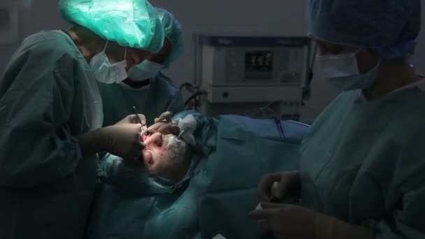 RUSSIA, S.PETERSBURG 2013: Plastic surgeon and an assistant make man operation — Stock Video