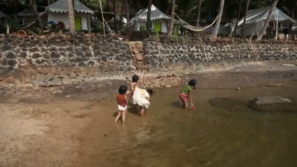 INDIA, GOA - 2012: Indian children girls play in the water — Stock Video