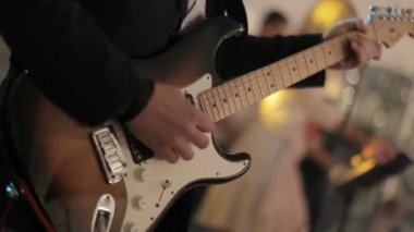 Concert rock band performing on stage with singer