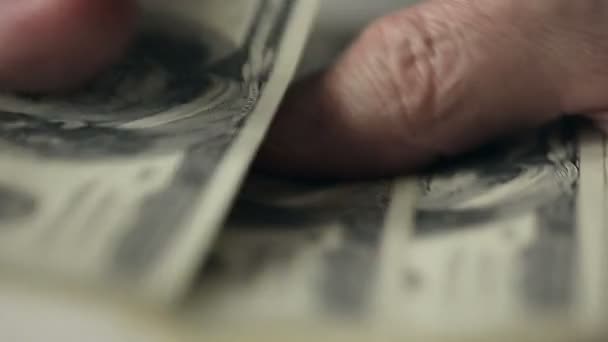 Close up a businessman's hands counting hundred dollar bills at a table. Slow motion — Stock Video