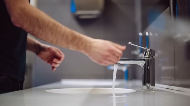 A man washes his hands and face. Slow motion — Stock Video