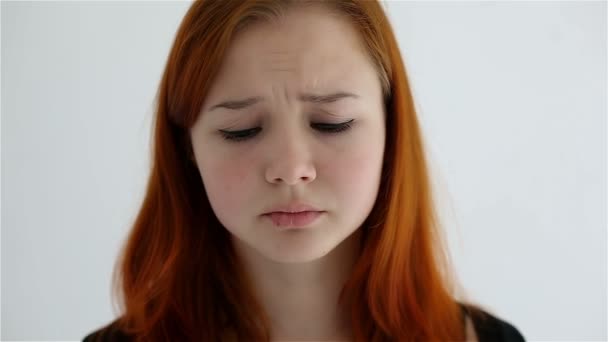 Unhappy sad teenage girl isolated at white background — Stock Video