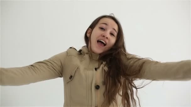 Young woman winning cheering and joying at white background — Stock Video