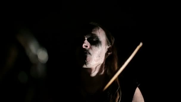 Drummer of black metal band. Close up face at dark background — Stock Video