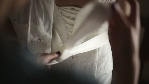 Bridal corset is being tied up — Stock Video