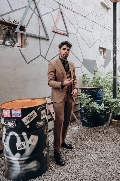 business suit on a dark-skinned man, tuxedo, three-piece suit