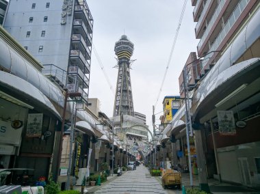 OSAKA, JAPAN - APRIL 4, 2018: Tsutenkaku Tower translates to Tower to Heaven in Osaka, Japan. Tsutenkaku Tower is one of the oldest and most important landmarks in Osaka.