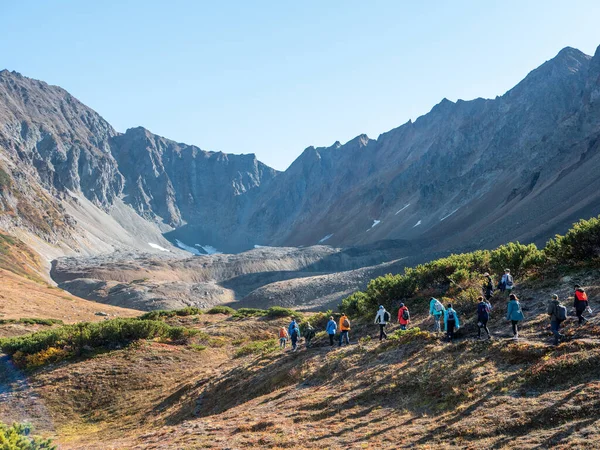 View of the volcano crater Vachkazhets mountain range. The remains of a large volcano crater attracts tourists with its unusual beauty. Kamchatka Peninsula, Russia.