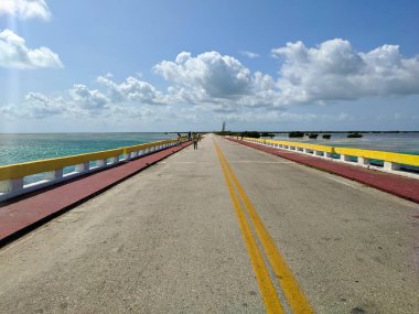 Cayo Coco, Cuba, 16 may 2021: Tourists cross the Hemingway Bridge on foot and admire the sea views. The Hemingway Bridge connects the Cuban islands of Cayo Coco and Cayo Guillermo.