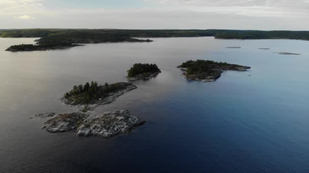 Aerial view Island with rocky shore and pine forest in Russian Karelia. Ladoga. — Stock Video