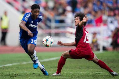 Ola Aina no.39 (L) of Chelsea in action