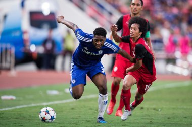 Ola Aina (L) of Chelsea in action