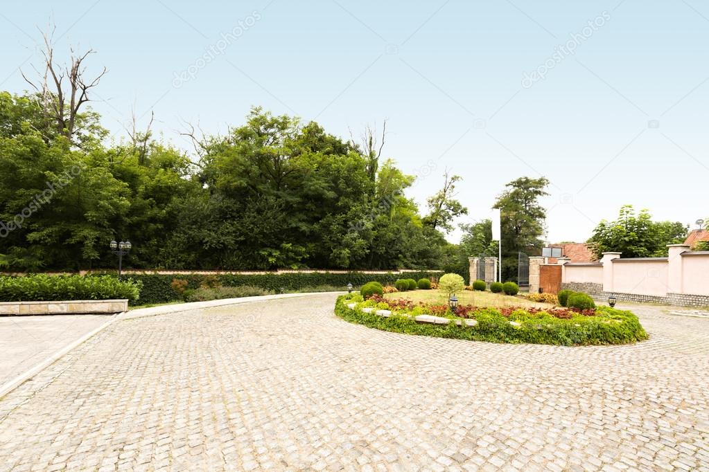 Cobblestone driveway in front of a villa