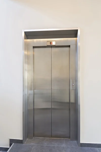 Closed elevator door in hotel lobby — Stock Photo, Image