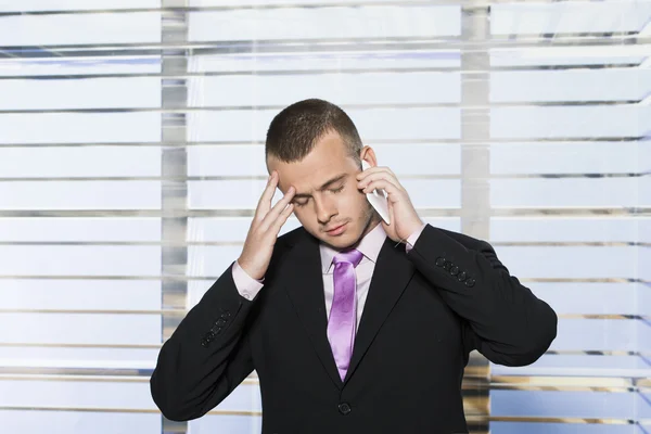 Frustrated businessman on the phone — Stock Photo, Image