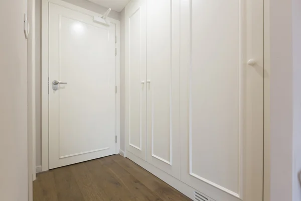 Interior of a white hotel corridor with closet — Stock Photo, Image