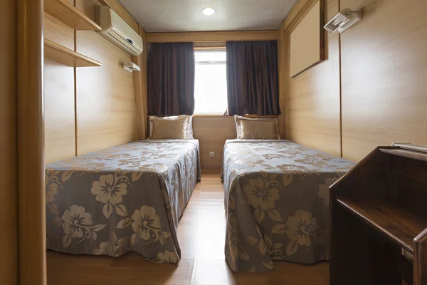 Interior of a cabin bedroom on cruise boat hotel