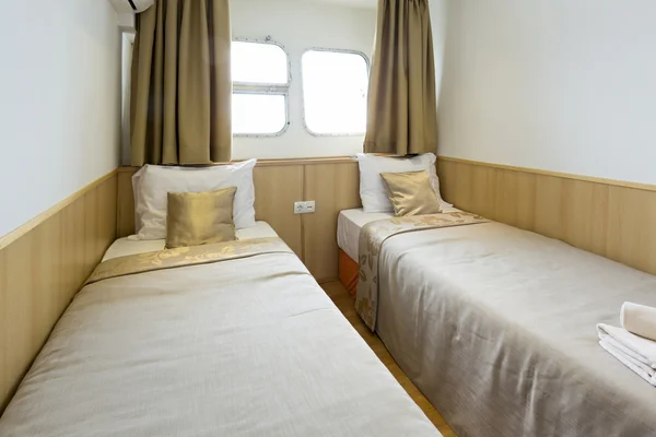 Interior of a cabin bedroom on cruise boat hotel