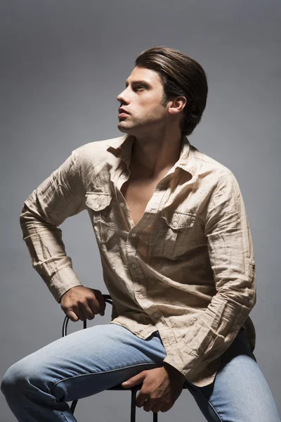 Handsome man in shirt and jeans — Stock Photo, Image