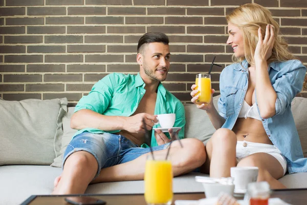 Young attractive couple relaxing at home — Stock Photo, Image