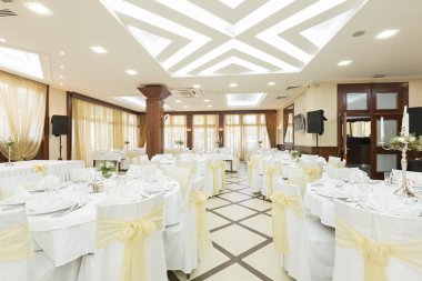 Wedding hall or other function facility set for fine dining clipart
