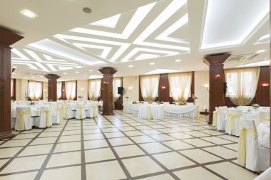 Wedding hall or other function facility set for fine dining clipart