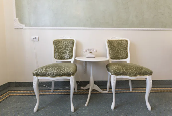 Chairs and table in hotel corridor — Stock Photo, Image