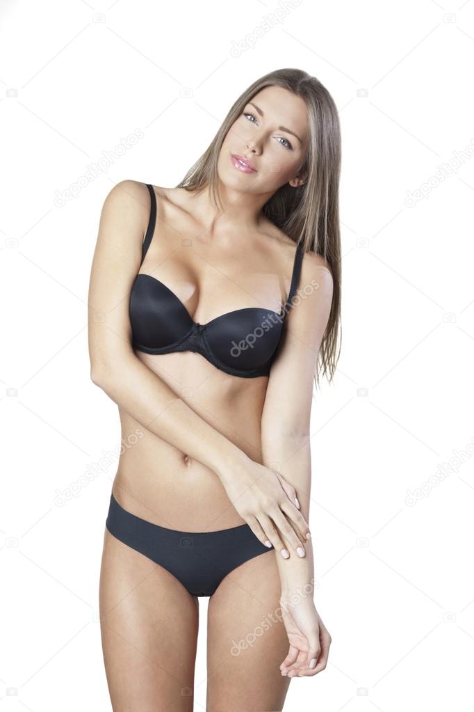 Young woman in black bra and panties isolated on white Stock Photo