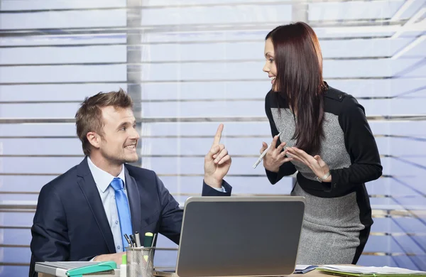 Man and woman joking around in office — Stock Photo, Image