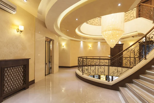 Beautiful chandelier in hotel interior — Stock Photo, Image