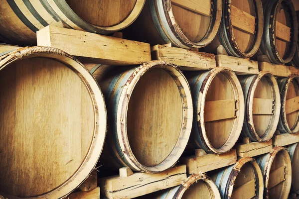 Barrels stacked in a wine cellar — Stock Photo, Image