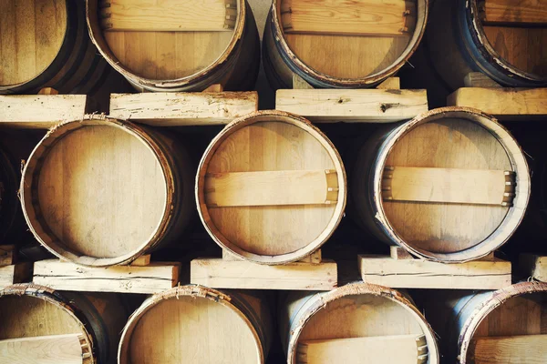 Barrels stacked in a wine cellar — Stock Photo, Image