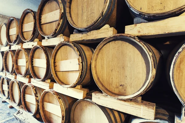 Barrels stacked in a wine cellar — Stock Photo, Image