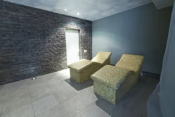 Hot stone chairs in spa interior — Stock Photo, Image