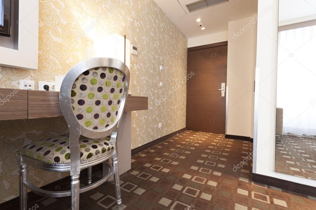 Luxury hotel room interior - hallway and chair