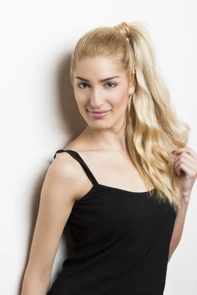 Beautiful blonde woman with ponytail — Stock Photo, Image