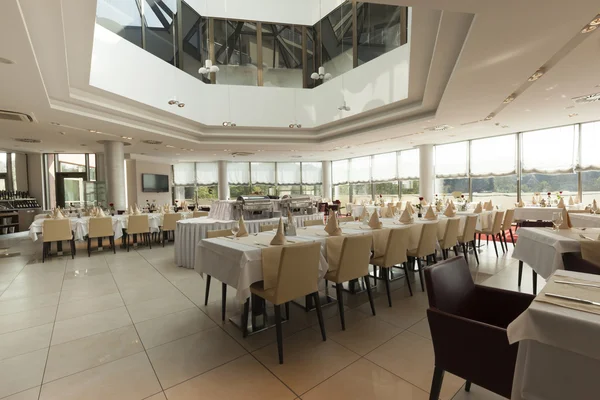 Bright restaurant interior with tables arranged for special even — Stock Photo, Image