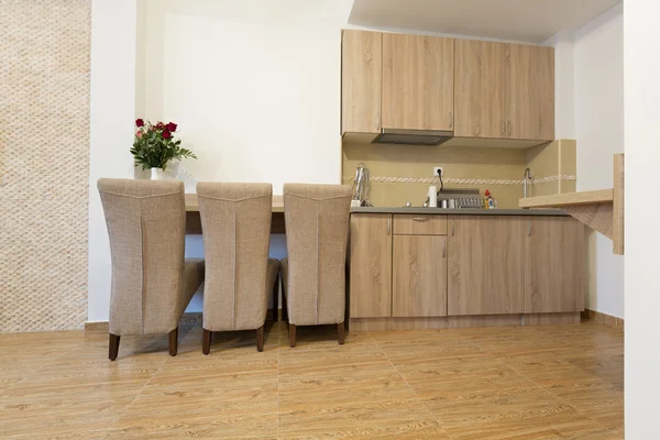 Kitchen and dining table in small apartment — Stock Photo, Image