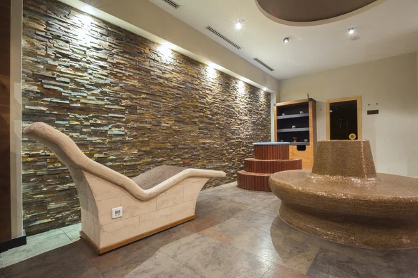 Modern spa interior with hot stone chairs — Stock Photo, Image